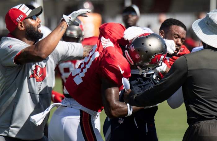 Buccaneers wide receiver Antonio Brown punches Titans cornerback Chris Jackson.